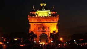 Tranquil Vientiane cityscape at dawn for a Vientiane Tours banner by Legend Travel Group.